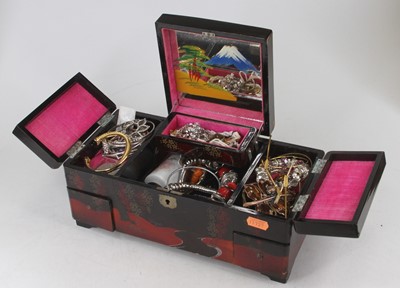 Lot 321 - A Japan lacquered jewellery box and contents...