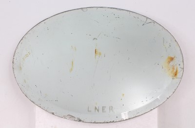 Lot 105 - An original LNER oval mirror with bevelled...