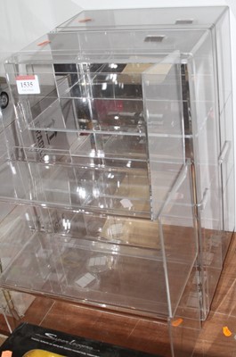 Lot 1642 - A quantity of plastic shelving and showcases...