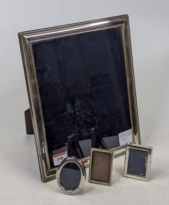 Lot 318 - An Elizabeth II silver clad photograph frame,...