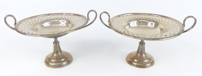 Lot 83 - A pair of Art Nouveau silver pedestal twin...