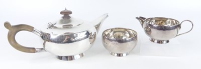 Lot 96 - An Art Deco silver three-piece tea set,...