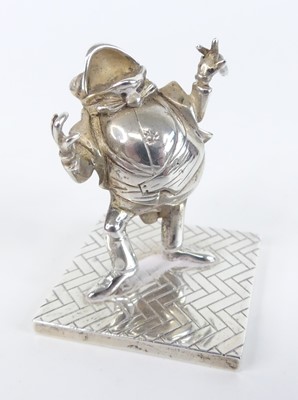 Lot 99 - A contemporary novelty silver figure of a...