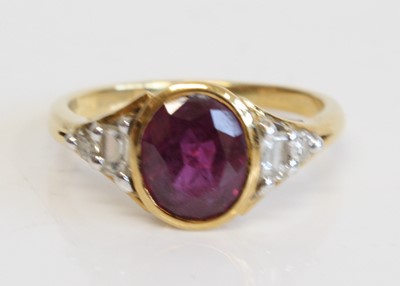 Lot 1279 - An 18ct yellow gold ruby and diamond dress...