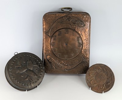 Lot 142 - A Newlyn style Arts and Crafts copper clock...