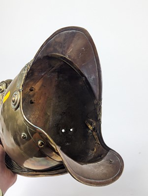 Lot 5 - A 19th century brass fireman's helmet, height...