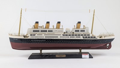 Lot 7 - A painted wooden model of The Titanic on stand,...