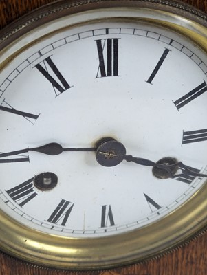 Lot 51 - A late Victorian oak cased mantel clock, the...