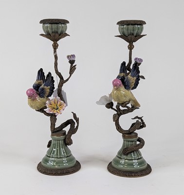 Lot 55 - *A pair of ornate table candlesticks, each...