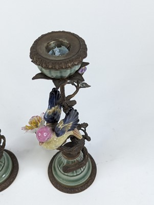 Lot 55 - *A pair of ornate table candlesticks, each...