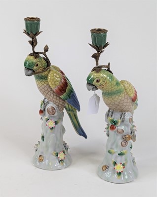 Lot 59 - A pair of table candlesticks each in the form...