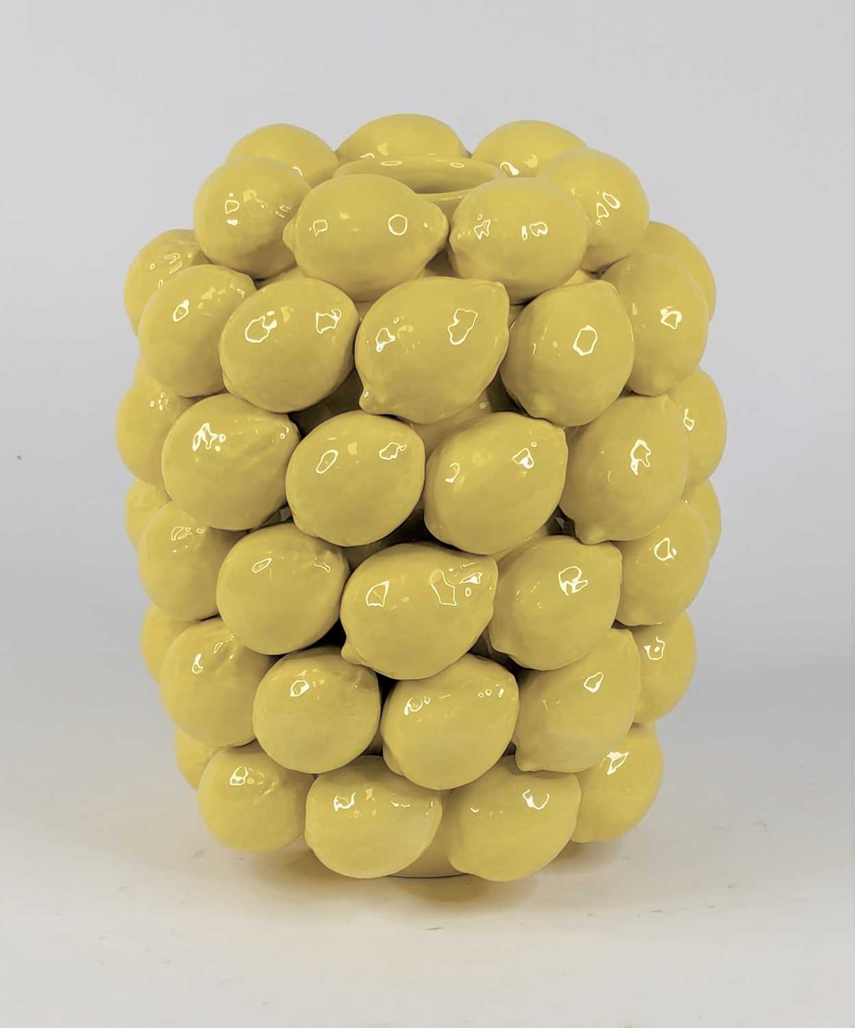 Lot 61 - A yellow glazed vase with high relief lemon...