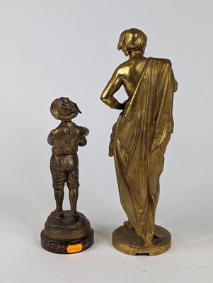 Lot 65 - *A gilt painted spelter figure of a boy...