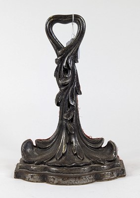 Lot 69 - *A cast metal doorstop in the form of acanthus...