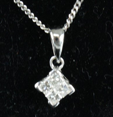 Lot 2544 - An 18ct white gold diamond pendant and chain,...