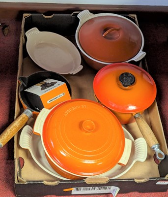 Lot 103 - A collection of Le Creuset orange enamelled...