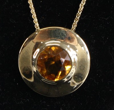 Lot 1237 - A 9ct yellow gold citrine circular target...