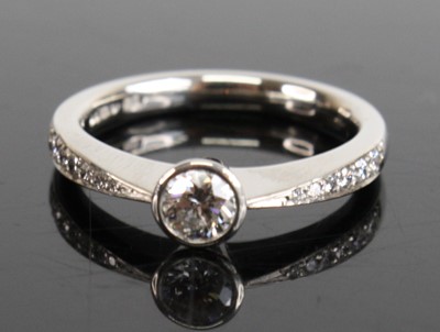 Lot 1232 - A platinum diamond solitaire ring, comprising...