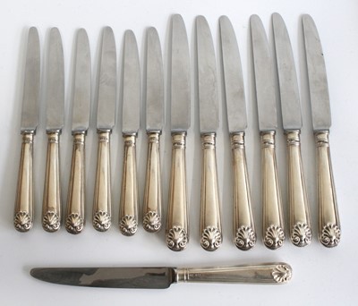 Lot 1210 - A set of twelve Elizabeth II silver handled...