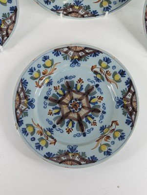 Lot 1101 - A set of four Lambeth polychrome delftware...