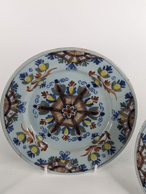 Lot 1101 - A set of four Lambeth polychrome delftware...