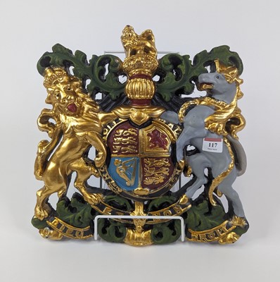 Lot 117 - A reproduction painted resin Royal Coat of...