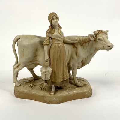 Lot 140 - A Royal Dux porcelain figure of a milk maid...