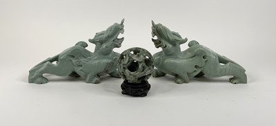 Lot 143 - *A pair of Chinese carved green hardstone...