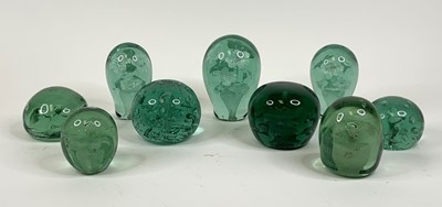 Lot 146 - A collection of nine Victorian green glass...
