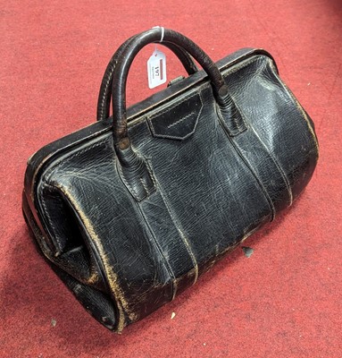 Lot 197 - An early 20th century black leather Gladstone...