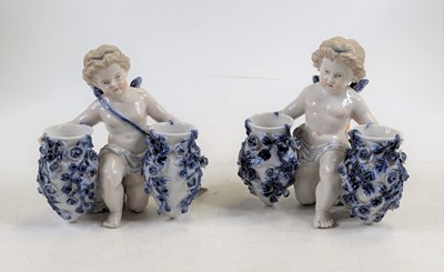 Lot 234 - *A pair of Sitzendorf porcelain figural spill...