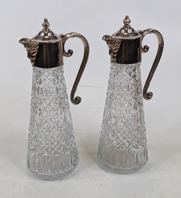 Lot 250 - A pair of glass claret jugs, each having...