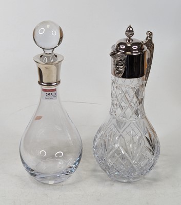 Lot 253 - An Elizabeth II glass decanter having a silver...