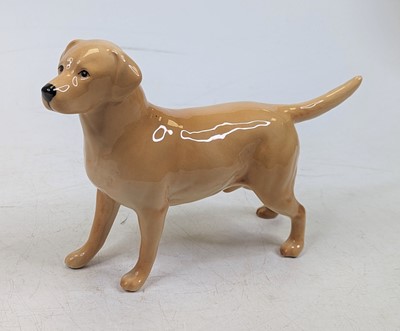 Lot 257 - A Beswick Pottery figure of a yellow labrador,...