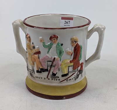 Lot 267 - A Victorian Staffordshire twin handled loving...