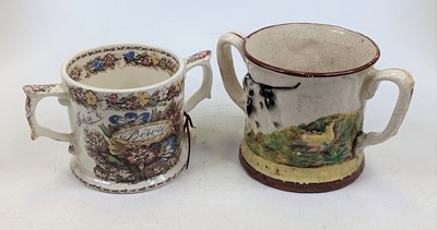 Lot 263 - A Victorian Staffordshire twin handled loving...