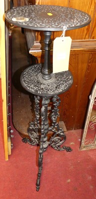 Lot 1160 - *A black painted pierced cast iron two-tiered...