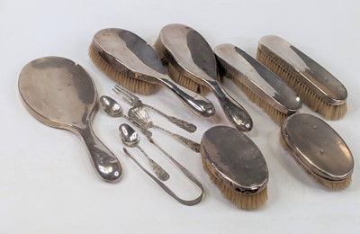 Lot 326 - A matched silver clad dressing table brush set,...