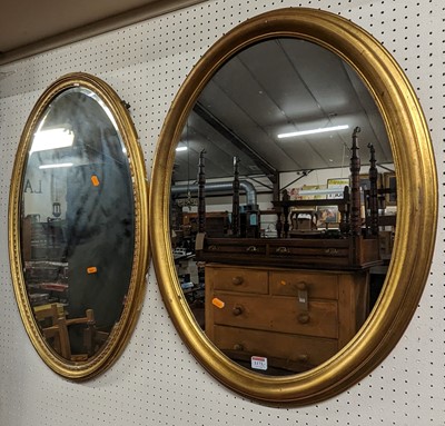 Lot 1173 - Two gilt framed oval wall mirrors, the larger...