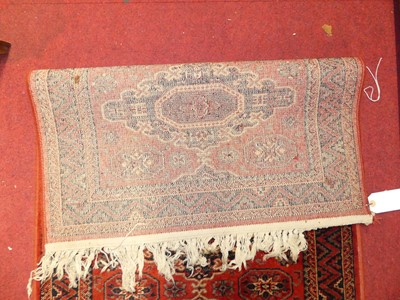 Lot 1199 - Two Persian style red ground woollen Bokhara...