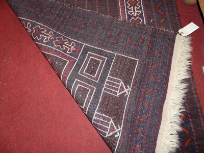 Lot 1200 - A Persian woollen prayer rug, the central...