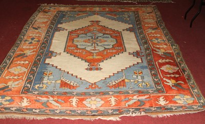 Lot 1201 - A Turkish woollen multicoloured ground rug,...
