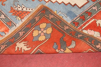 Lot 1201 - A Turkish woollen multicoloured ground rug,...