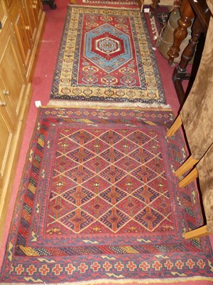 Lot 1203 - *A Persian woollen red and blue ground Oushak...
