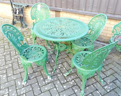 Lot 1193 - A green painted pierced galvanised metal patio...