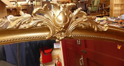 Lot 1195 - A Victorian gilt framed arched over mantel...