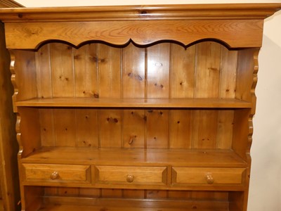 Lot 1225 - A contemporary pine kitchen dresser, w.129cm