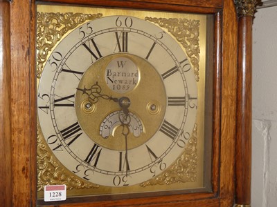 Lot 1228 - A circa 1800 provincial oak longcase clock,...
