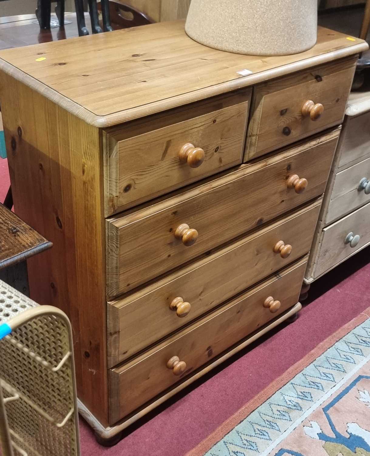 Lot 1262 - A modern pine round cornered chest of two...