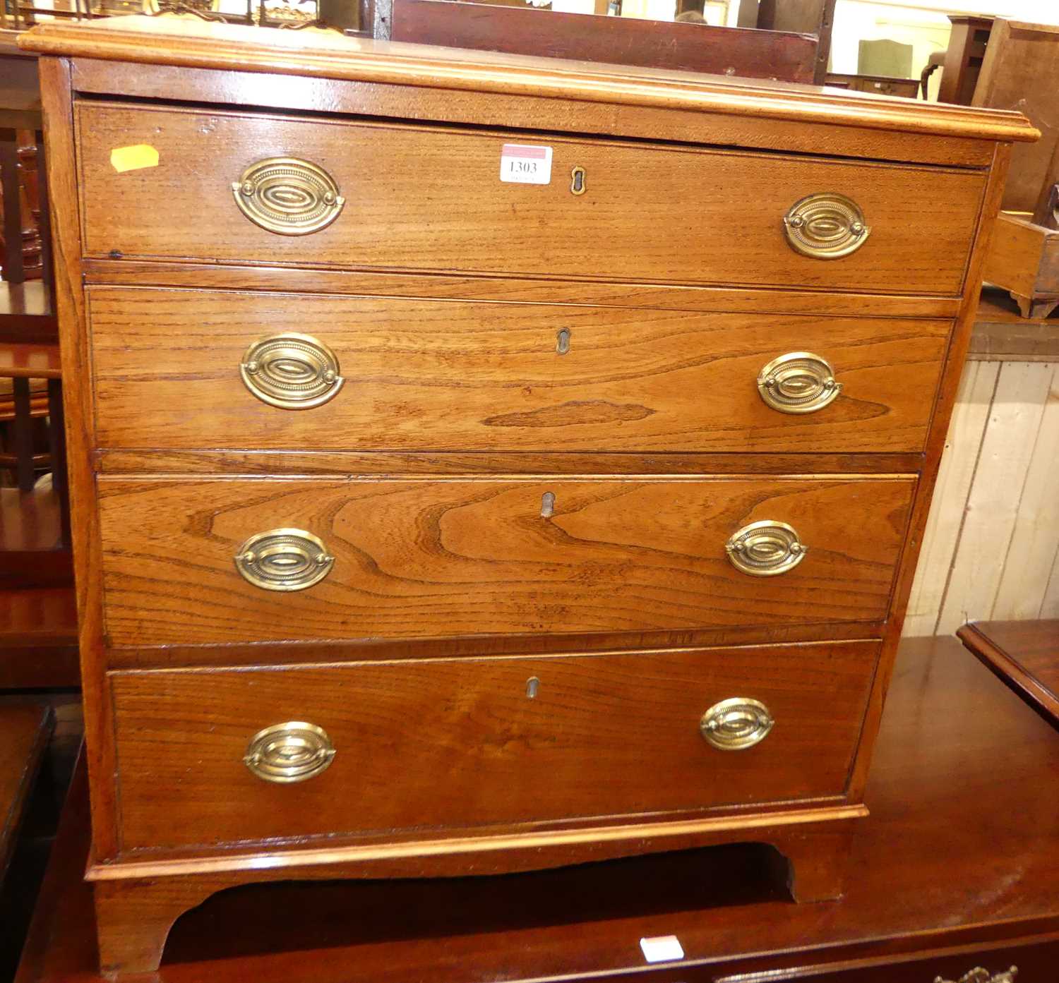 Lot 1303 - A circa 1800 small provincial elm chest of...